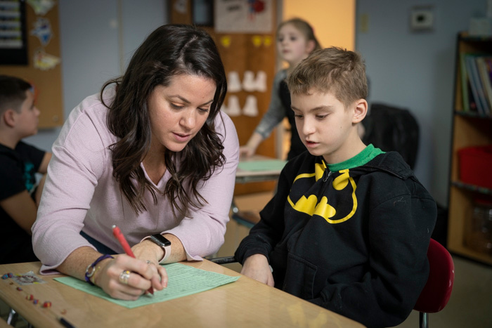 Centennial School teacher working with Student